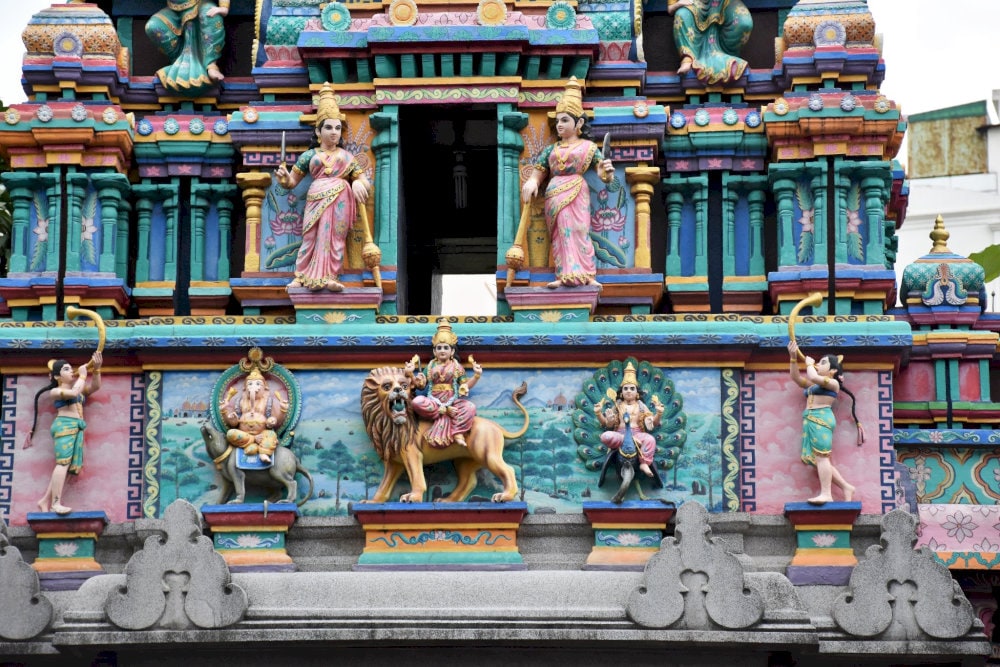 Panoramic view of the vibrant Gopuram tower, adorned with multi-tiered Hindu deities